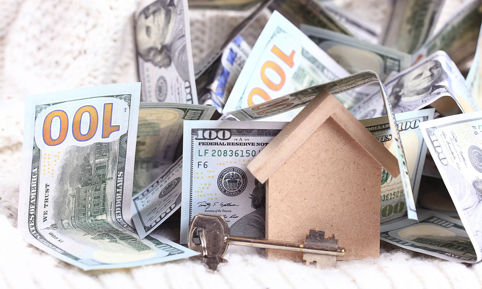 wooden toy house - the concept of housing purchase mortgage doll